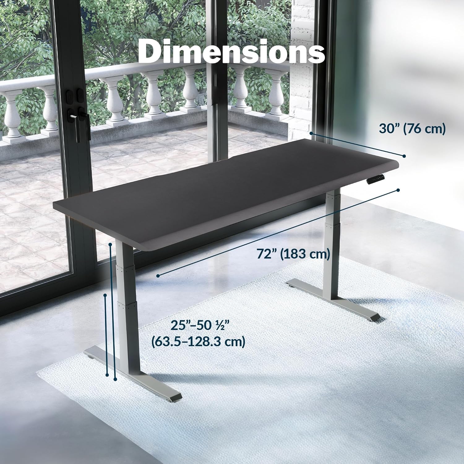 Large black electric standing desk with height-adjustable frame and sloped edge design — view 2
