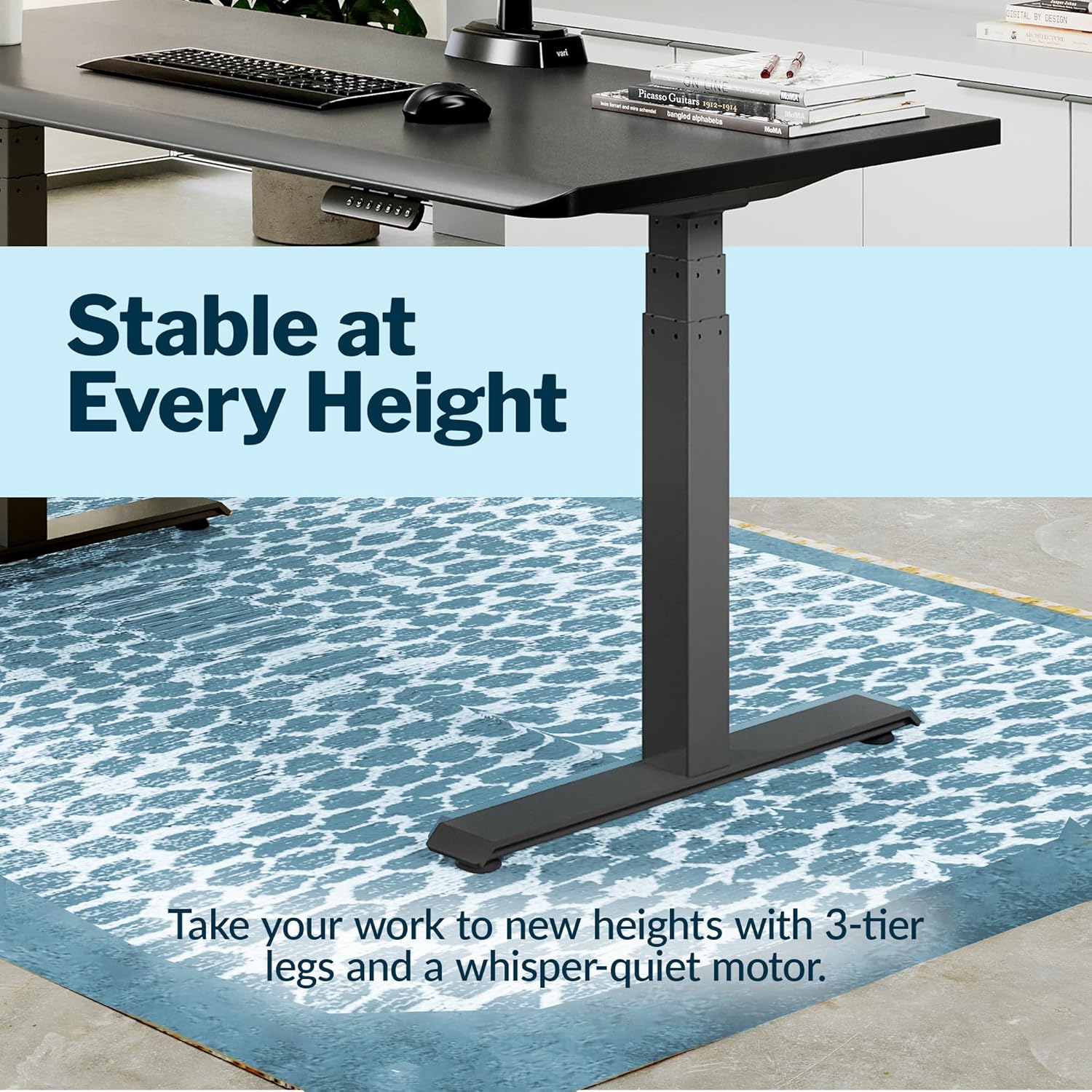 Large black electric standing desk with height-adjustable frame and sloped edge design — view 4