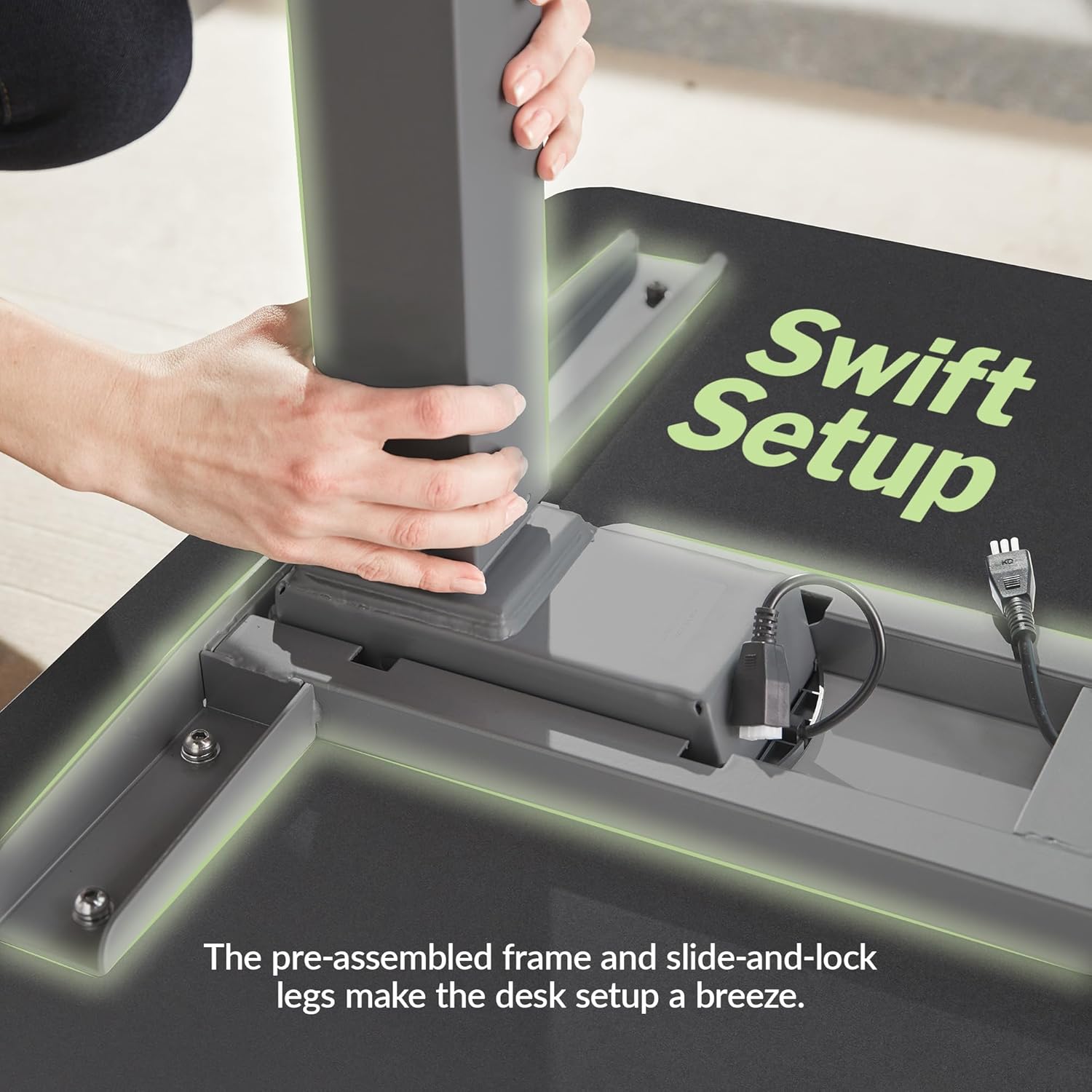 Large black electric standing desk with height-adjustable frame and sloped edge design — view 2
