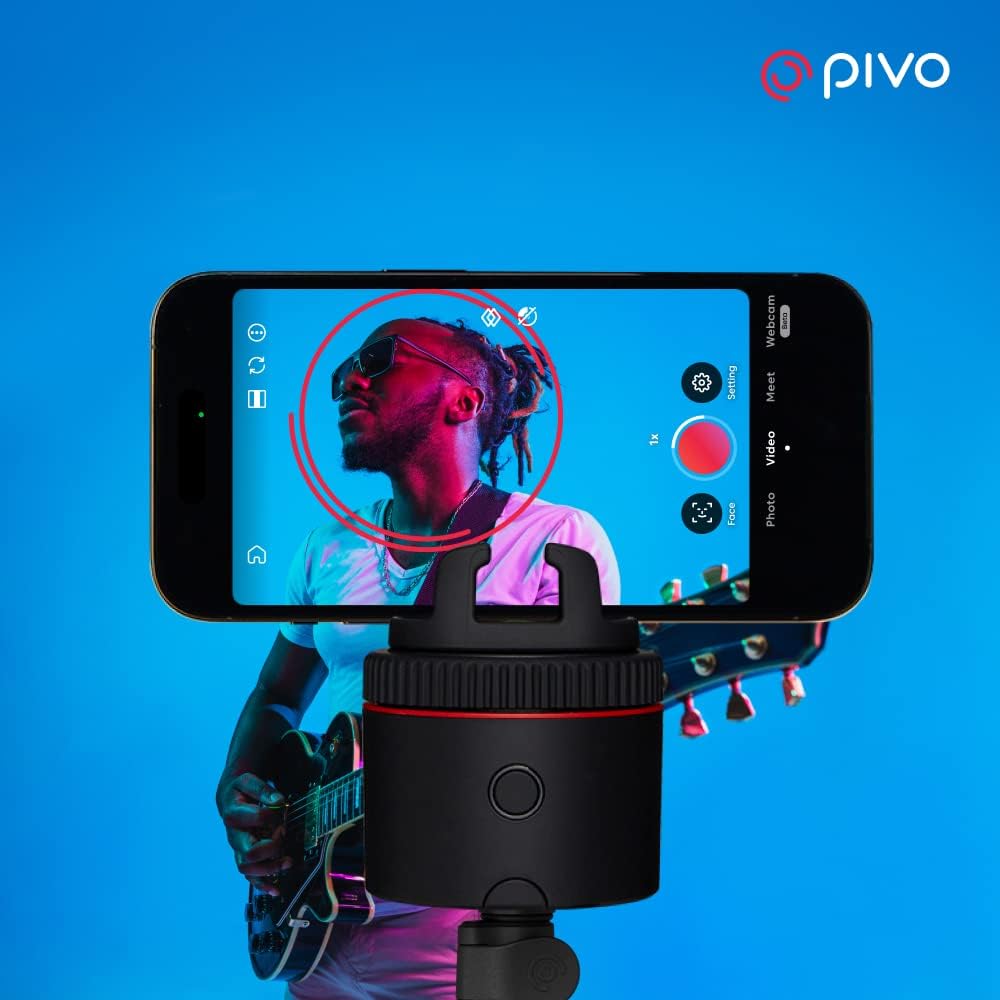 Auto-tracking phone holder with 360° rotation and sleek black finish, showing mounted smartphone during video recording — view 2