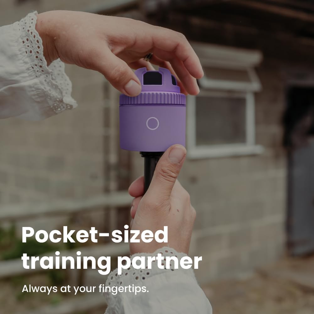 Purple auto-tracking phone holder with 360° rotation mounted on stand, showing remote control and tracking indicators — side